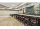 Finished basement bar area with pendant lighting and a full bar setup at 3705 Williams Point Dr, Cumming, GA 30028