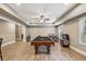 Basement showcasing a billiards table and arcade games for entertainment at 3705 Williams Point Dr, Cumming, GA 30028