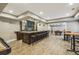 Finished basement with a long bar and a rec room, perfect for entertaining at 3705 Williams Point Dr, Cumming, GA 30028