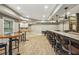 Entertaining basement area with a granite-topped bar and ample seating at 3705 Williams Point Dr, Cumming, GA 30028