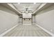 Finished basement space with recessed lighting and custom ceiling design at 3705 Williams Point Dr, Cumming, GA 30028