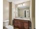 Bathroom with granite countertops and wood cabinets with ample storage at 3705 Williams Point Dr, Cumming, GA 30028