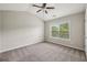 Bedroom features neutral carpet, ample natural light, and a vaulted ceiling at 3705 Williams Point Dr, Cumming, GA 30028