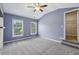 Bedroom features a vaulted ceiling, carpet, and closet at 3705 Williams Point Dr, Cumming, GA 30028