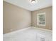 Bedroom with natural light, marble floors, and neutral color palette at 3705 Williams Point Dr, Cumming, GA 30028