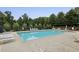 Community pool with lounge chairs and umbrellas, perfect for summer relaxation at 3705 Williams Point Dr, Cumming, GA 30028