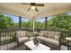 Cozy screened-in porch with comfortable seating and views of the backyard at 3705 Williams Point Dr, Cumming, GA 30028