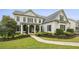 Charming front exterior with landscaped garden and covered porch, creating inviting curb appeal at 3705 Williams Point Dr, Cumming, GA 30028