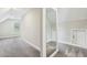 Attic hallway with neutral carpet and natural light at 3705 Williams Point Dr, Cumming, GA 30028