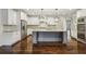 Lovely kitchen with large island, stainless appliances and custom cabinets at 3705 Williams Point Dr, Cumming, GA 30028