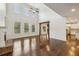 Spacious living room with fireplace, hardwood floors, vaulted ceilings, and abundant natural light at 3705 Williams Point Dr, Cumming, GA 30028