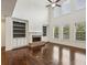 Bright living room boasting built-in shelving, a fireplace, and tall windows with natural views at 3705 Williams Point Dr, Cumming, GA 30028