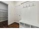 Mudroom with storage bench, coat hooks, and easy access to the pantry at 3705 Williams Point Dr, Cumming, GA 30028