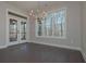 Cozy dining area with natural light, a modern chandelier, and access to the screened porch at 4850 Cool Springs Rd, Winston, GA 30187