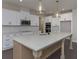 Well-equipped kitchen featuring a center island, white cabinetry, and stainless steel appliances at 4850 Cool Springs Rd, Winston, GA 30187