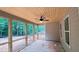 A screened patio with wood ceiling offers a relaxing space to enjoy the outdoor views and fresh air at 4850 Cool Springs Rd, Winston, GA 30187