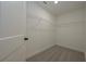 Compact walk-in closet with wire shelving and carpeted floor at 4850 Cool Springs Rd, Winston, GA 30187
