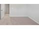 Bright bedroom with neutral carpet, white walls, and trim at 6934 Melody Ridge Rd, Buford, GA 30518