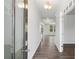 Inviting hallway with hardwood floors and neutral paint, leading to living areas at 6934 Melody Ridge Rd, Buford, GA 30518