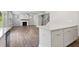 An open-concept design where a fireplace accents the living area that opens into the kitchen at 6934 Melody Ridge Rd, Buford, GA 30518