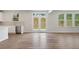 Bright open concept space with laminated floor, and a view of the backyard at 6934 Melody Ridge Rd, Buford, GA 30518