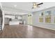 Open concept living and kitchen area with stainless steel appliances and french doors to the backyard at 6934 Melody Ridge Rd, Buford, GA 30518