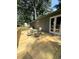 Outdoor wooden deck featuring a dining table set, ideal for outdoor entertaining and relaxation at 205 Trickum Hills Ln, Woodstock, GA 30188