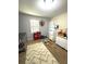 Neutral bedroom featuring a play kitchen and toys at 205 Trickum Hills Ln, Woodstock, GA 30188