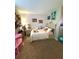 Brightly lit ' room with whimsical wall decor and a cozy bed at 205 Trickum Hills Ln, Woodstock, GA 30188