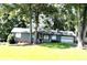 Charming single-story home with a well-maintained lawn and a two-car garage at 205 Trickum Hills Ln, Woodstock, GA 30188