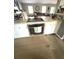 Modern kitchen with white cabinets, stainless steel oven, and granite countertops at 205 Trickum Hills Ln, Woodstock, GA 30188