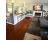 Open living space with stylish bar seating, fireplace, hardwood floors, and cozy rug at 205 Trickum Hills Ln, Woodstock, GA 30188