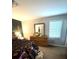 Bedroom featuring a large dresser, mirror, and natural light from the window at 205 Trickum Hills Ln, Woodstock, GA 30188