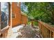 Well-maintained deck provides an outdoor oasis with views of the backyard and surrounding trees at 240 Old Plantation Way, Fayetteville, GA 30214