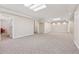 Spacious carpeted basement with recessed lighting and neutral paint; ideal for entertaining or recreation at 240 Old Plantation Way, Fayetteville, GA 30214