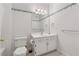 Bathroom featuring wallpaper, a toilet, and a white vanity with gold hardware at 240 Old Plantation Way, Fayetteville, GA 30214