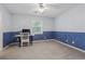 Bright bedroom features a desk by a window, complemented by a patterned accent wall at 240 Old Plantation Way, Fayetteville, GA 30214