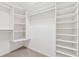 Walk-in closet featuring multiple shelves and rods for optimal storage at 240 Old Plantation Way, Fayetteville, GA 30214