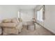 Cozy living room features neutral carpet, comfortable seating, and soft natural light at 240 Old Plantation Way, Fayetteville, GA 30214