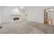 Spacious living room with a fireplace, neutral carpet, and ample natural light at 240 Old Plantation Way, Fayetteville, GA 30214