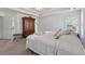 Main bedroom with a tray ceiling, an accent armoire, and neutral tones at 240 Old Plantation Way, Fayetteville, GA 30214