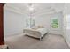 Main bedroom featuring tray ceilings, plush carpeting, and plentiful natural light at 240 Old Plantation Way, Fayetteville, GA 30214