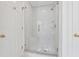 The shower boasts a glass door and marble tile, blending style and functionality at 240 Old Plantation Way, Fayetteville, GA 30214