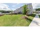 View of townhomes showcasing well-maintained lawn and a fenced backyard perfect for relaxation at 3554 Bluebird Ct, Atlanta, GA 30331