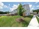 View of townhomes showcasing well-maintained lawn and a fenced backyard perfect for relaxation at 3554 Bluebird Ct, Atlanta, GA 30331