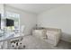 Cozy bedroom with natural light, plush carpeting, and neutral decor at 3554 Bluebird Ct, Atlanta, GA 30331