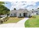 View of the clubhouse featuring inviting architecture and beautiful landscaping at 3554 Bluebird Ct, Atlanta, GA 30331