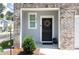 Inviting front entry with brickwork and black front door with wreath at 3554 Bluebird Ct, Atlanta, GA 30331