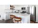 Kitchen with stainless appliances, island with seating, and white cabinetry at 3554 Bluebird Ct, Atlanta, GA 30331