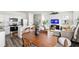 Open-concept living space with stainless appliances, ample seating, and a flatscreen TV, perfect for entertaining at 3554 Bluebird Ct, Atlanta, GA 30331